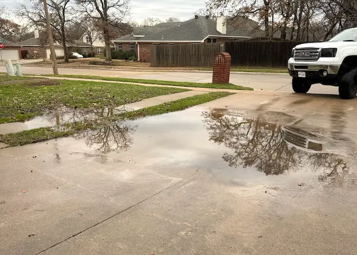 Sinking driveway causing water to pool